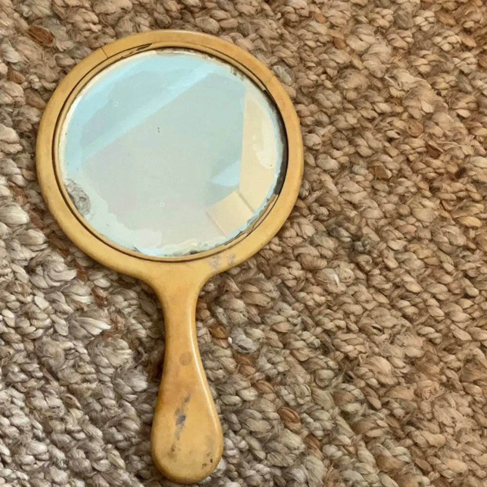Antique handheld vanity mirror
